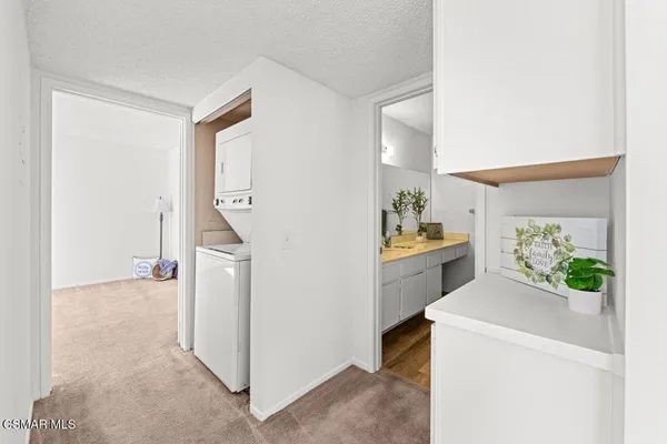 a view of hallway with washer and dryer
