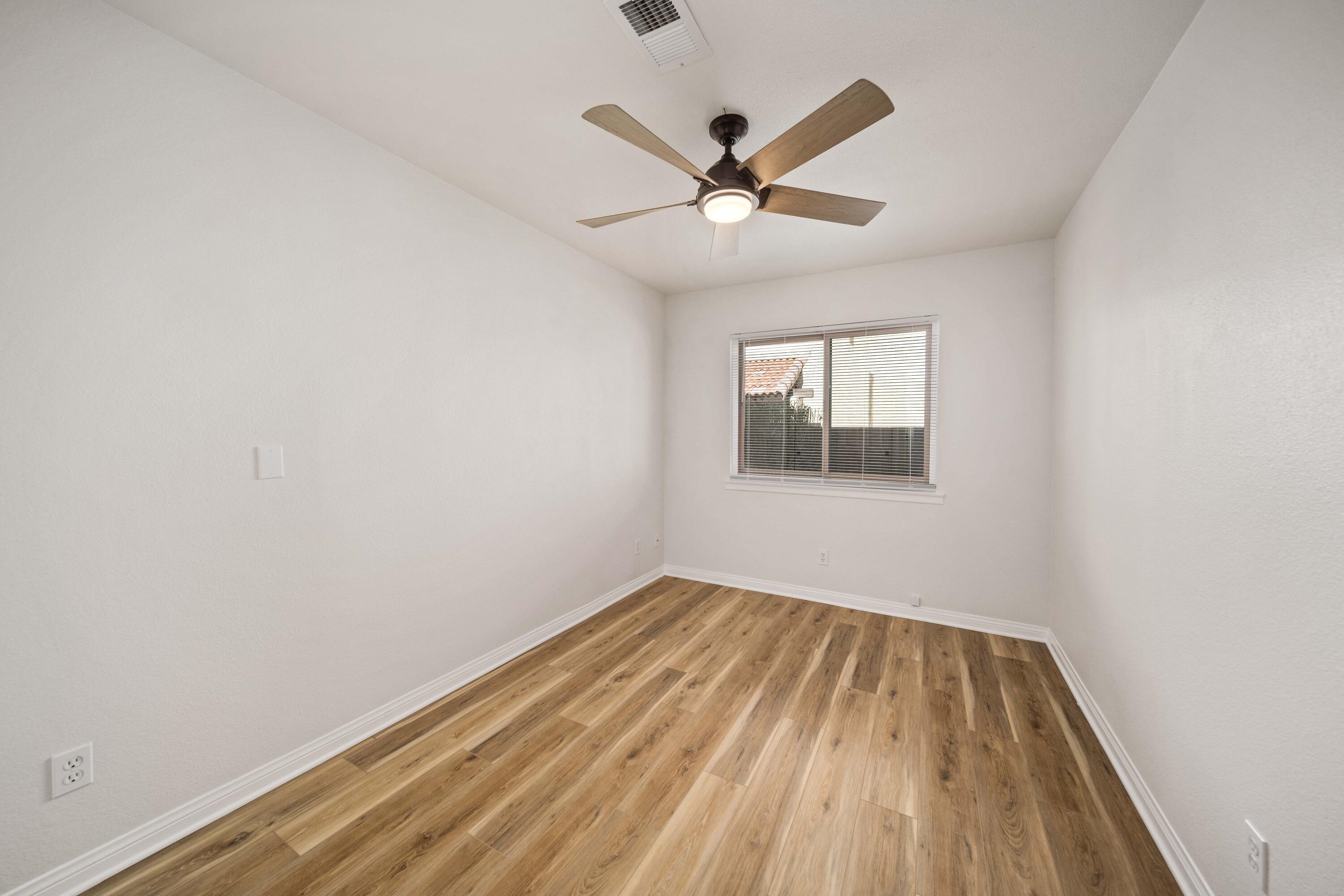 43734 Frieda Court Lancaster, CA 93535 - Photo 16 of 32 wooden floor in an empty room with a window