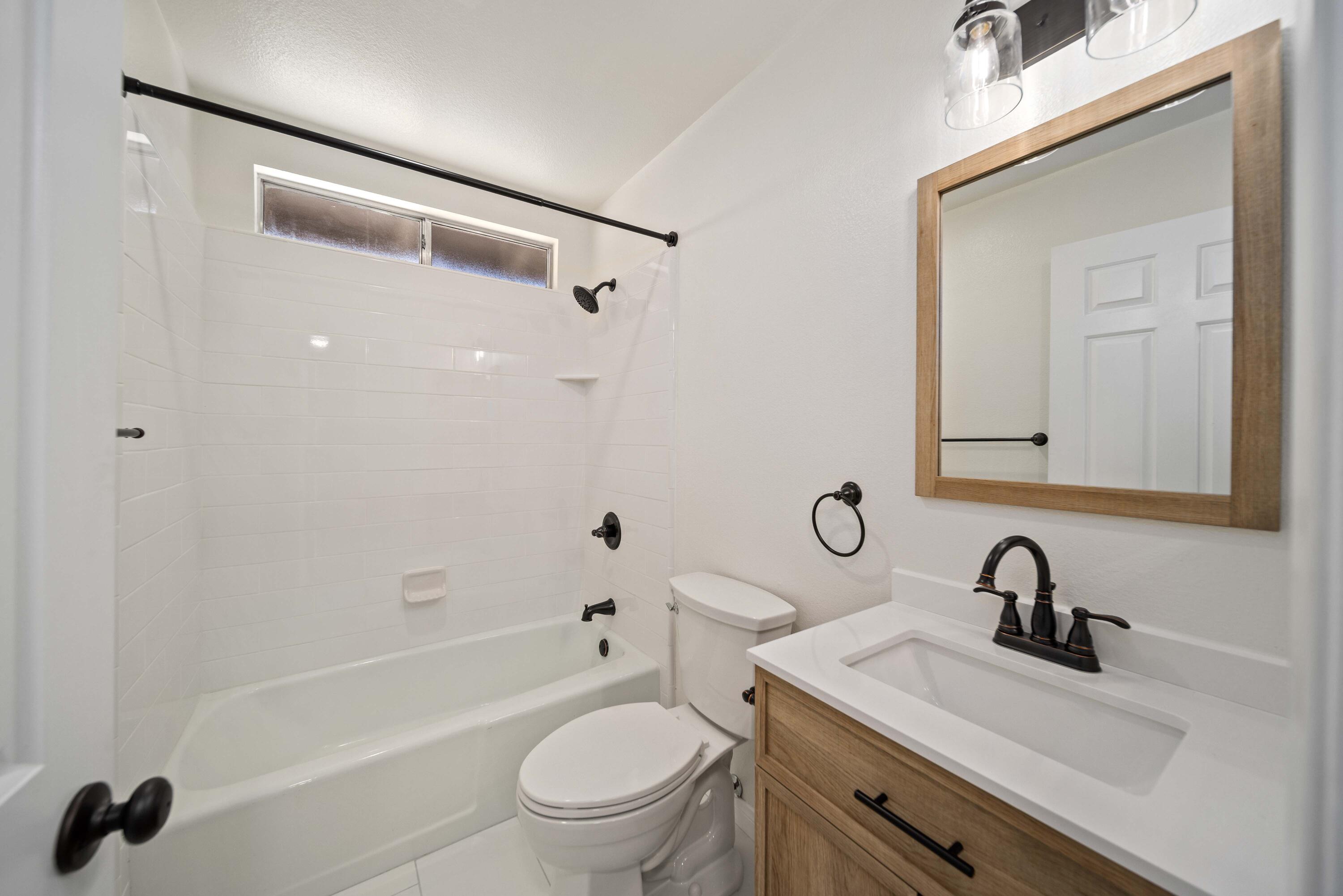 43734 Frieda Court Lancaster, CA 93535 - Photo 20 of 32 a bathroom with a sink toilet a vanity and shower