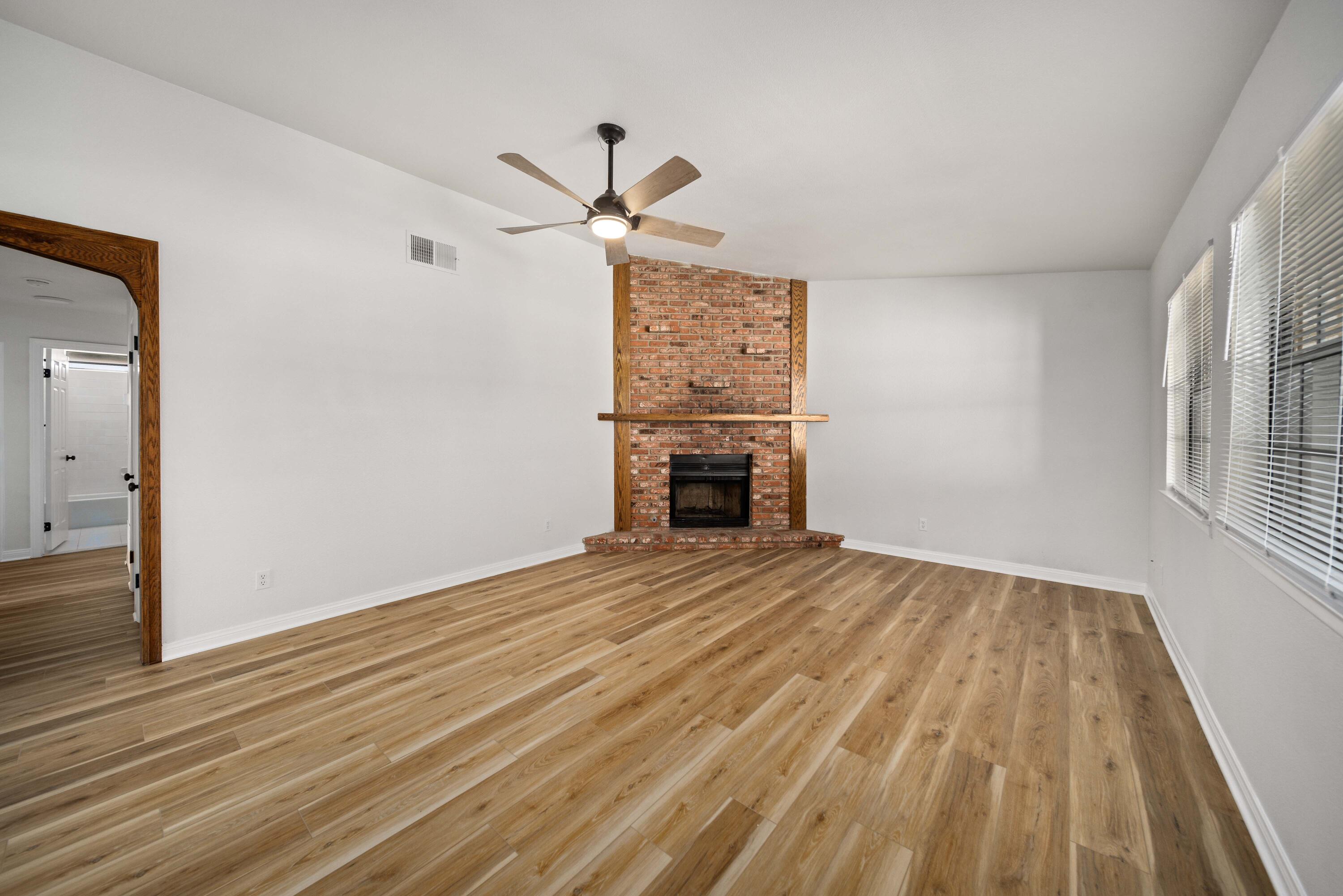 43734 Frieda Court Lancaster, CA 93535 - Photo 6 of 32 a view of empty room with wooden floor and fan