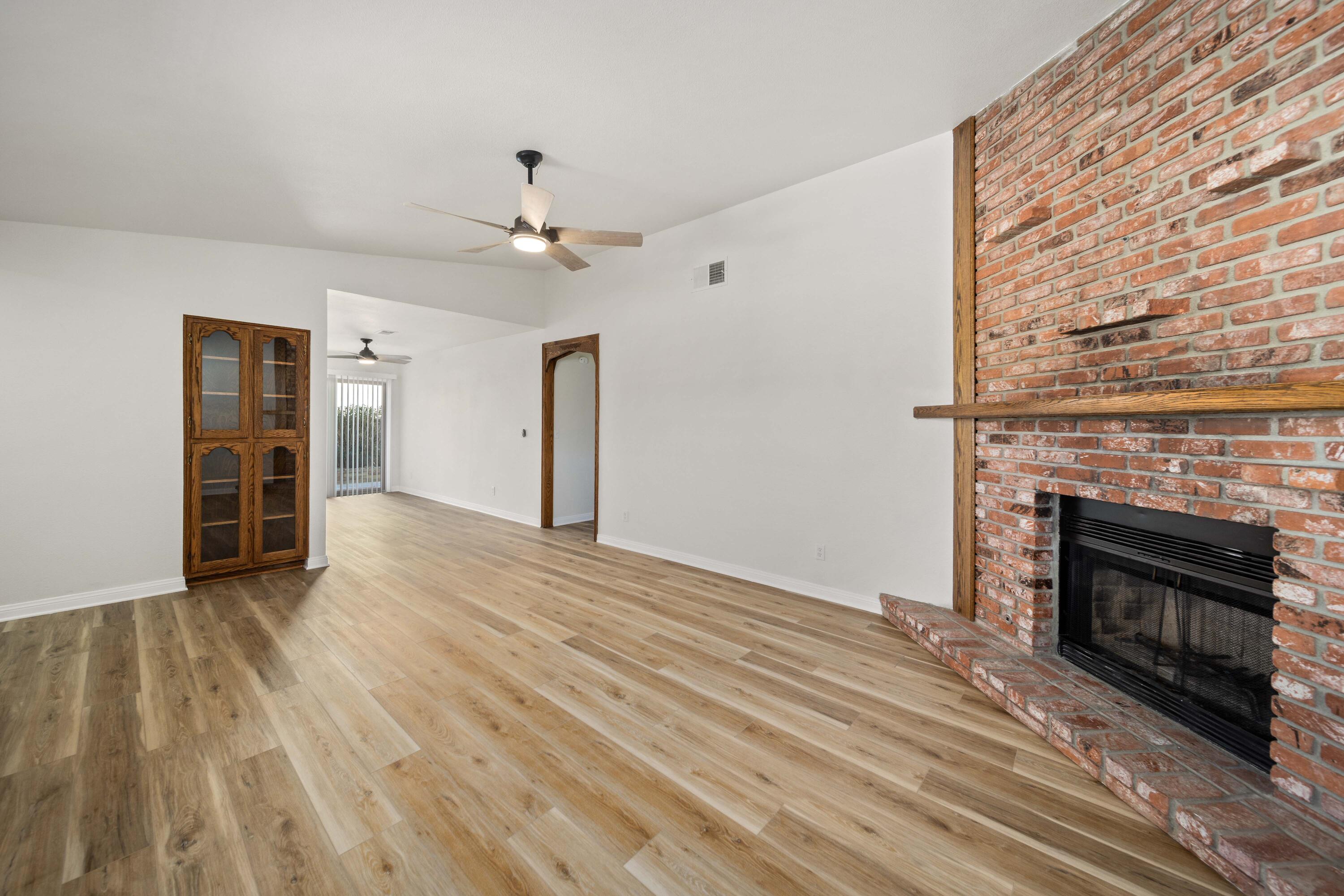 43734 Frieda Court Lancaster, CA 93535 - Photo 7 of 32 wooden floor fireplace and natural light