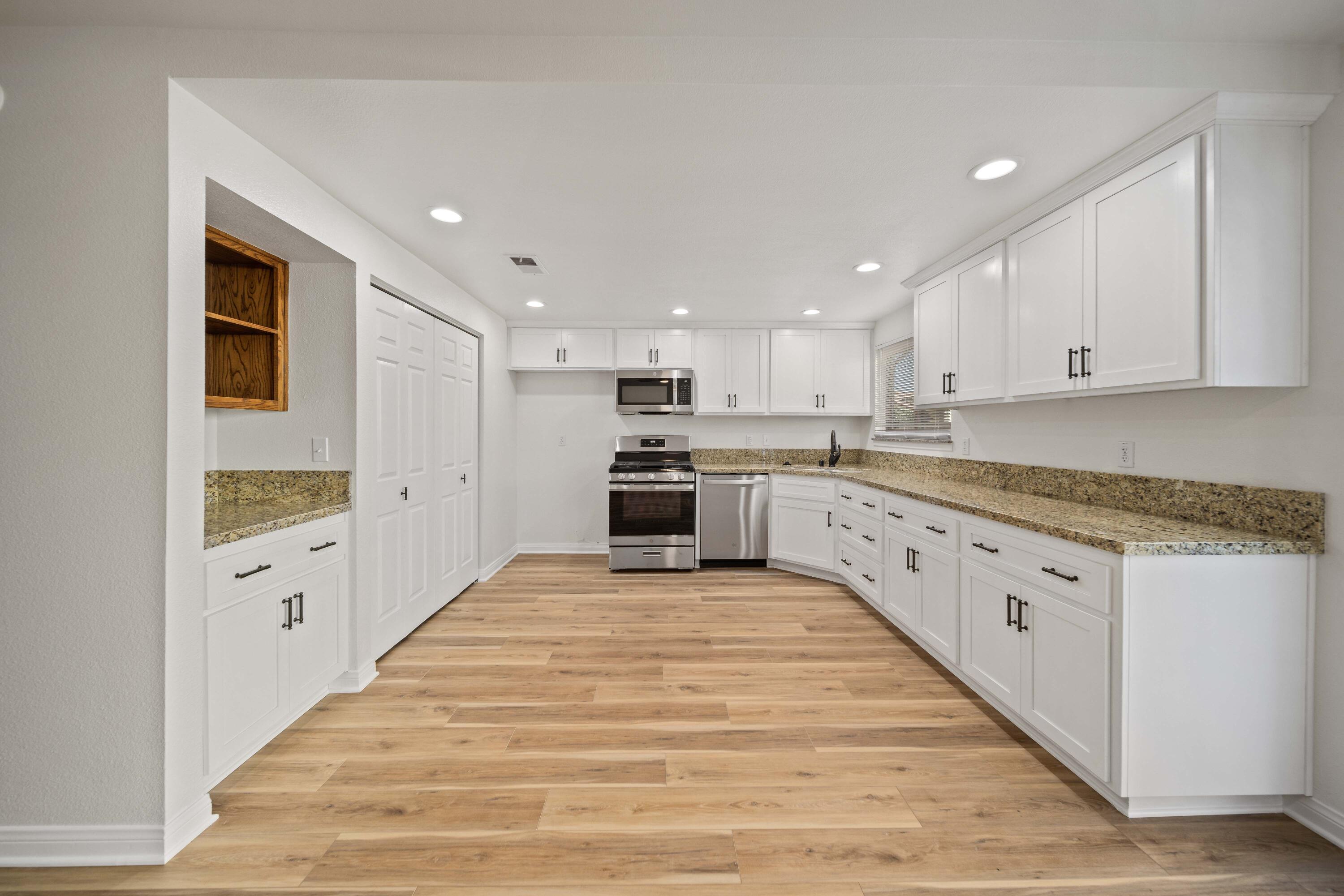 43734 Frieda Court Lancaster, CA 93535 - Photo 9 of 32 a large kitchen with cabinets