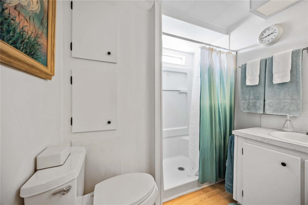 10303 Burnt Store Road, Unit 221 Punta Gorda, FL 33950 - Photo 17 of 31 a bathroom with a toilet a sink and shower