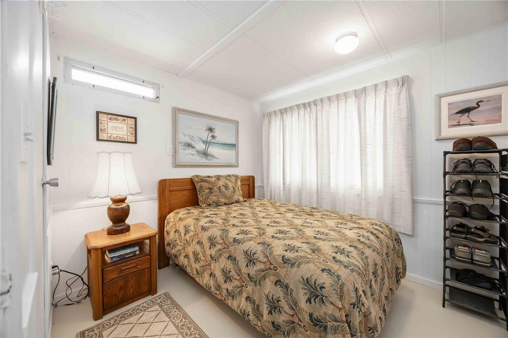 10303 Burnt Store Road, Unit 221 Punta Gorda, FL 33950 - Photo 19 of 31 a bedroom with a bed and a window