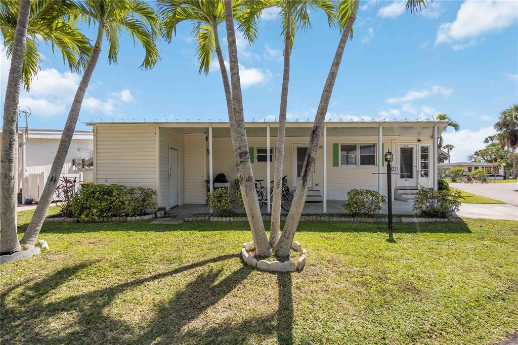 10303 Burnt Store Road, Unit 221 Punta Gorda, FL 33950 - Photo 20 of 31 a front view of a house with garden