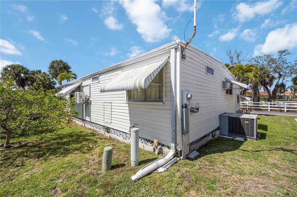10303 Burnt Store Road, Unit 221 Punta Gorda, FL 33950 - Photo 23 of 31 a view of a house with a yard