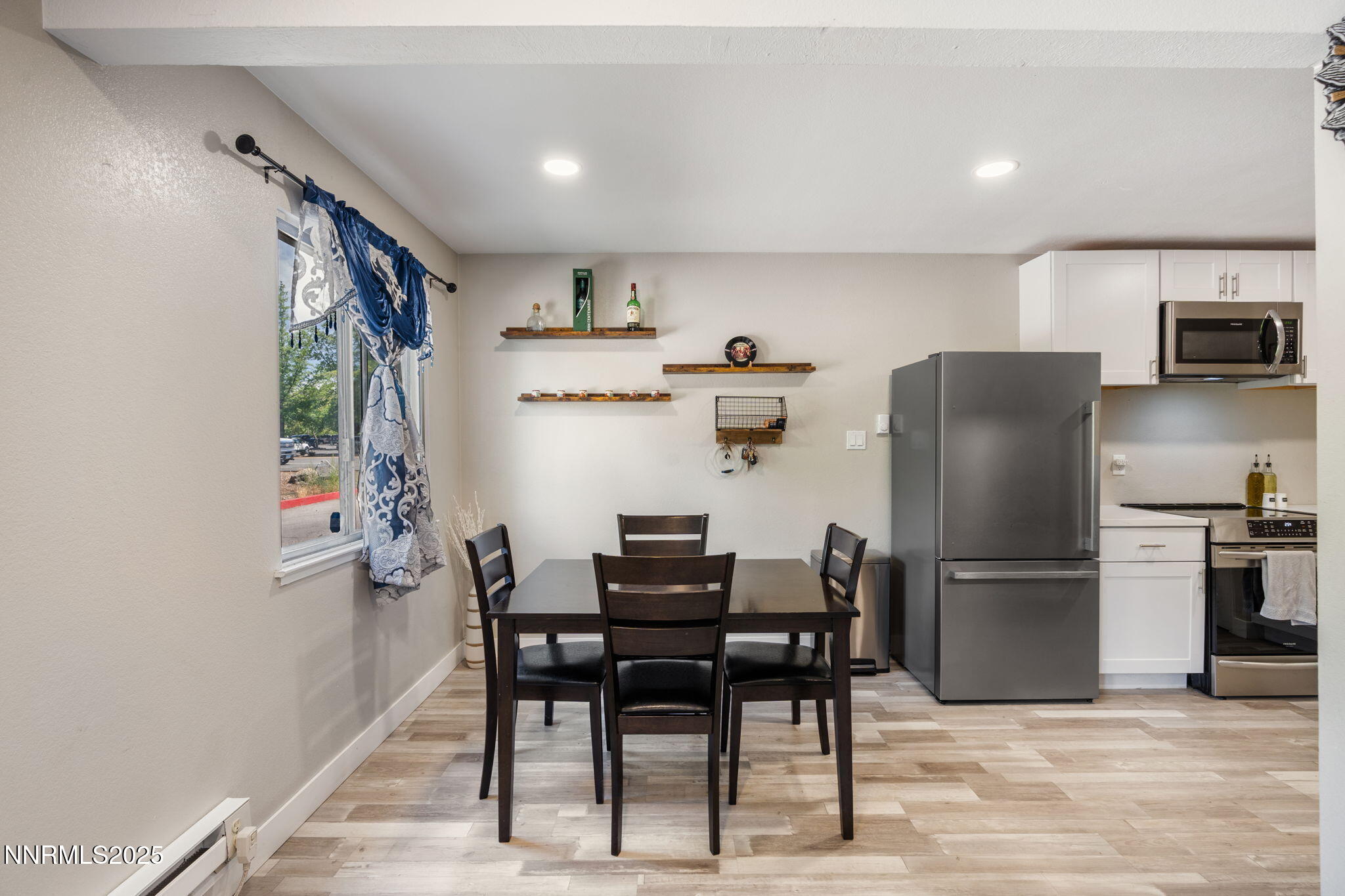940 Jamaica Avenue, Unit 3 Reno, NV 89502 - Photo 13 of 29 a view of a dining room with furniture and a kitchen view