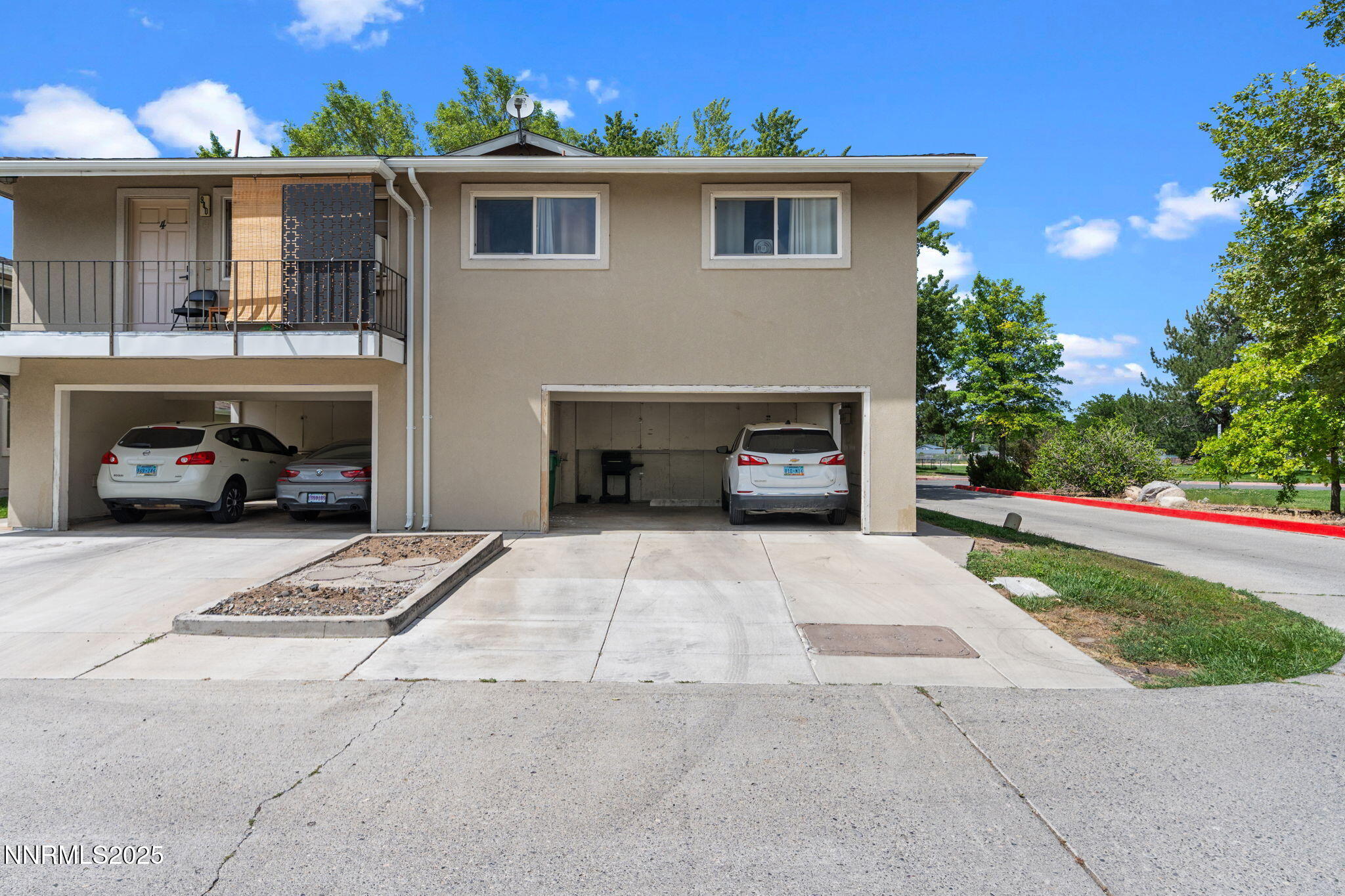 940 Jamaica Avenue, Unit 3 Reno, NV 89502 - Photo 24 of 29 a car parked in front of white house