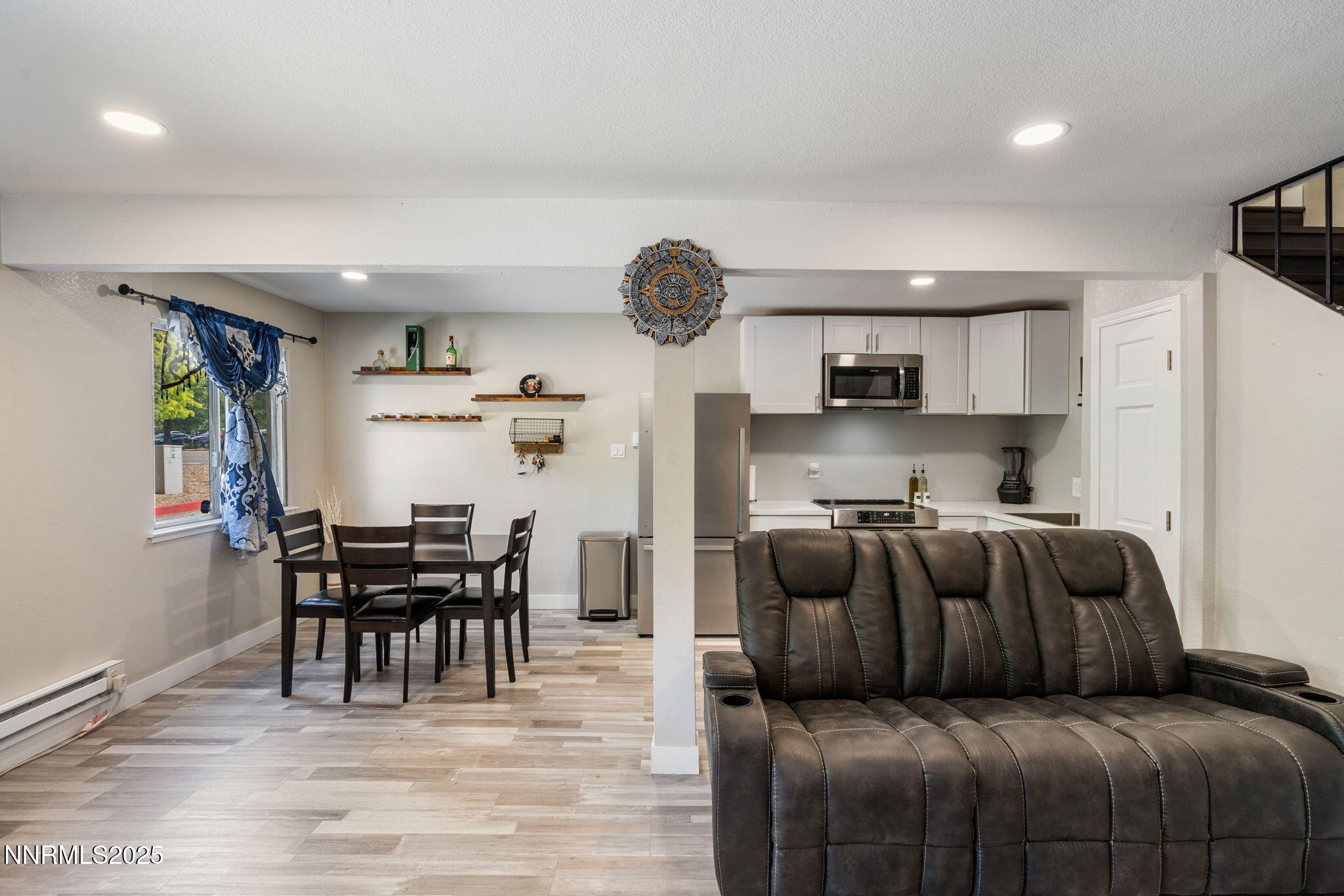940 Jamaica Avenue, Unit 3 Reno, NV 89502 - Photo 8 of 29 a kitchen with stainless steel appliances granite countertop a refrigerator and a dining table