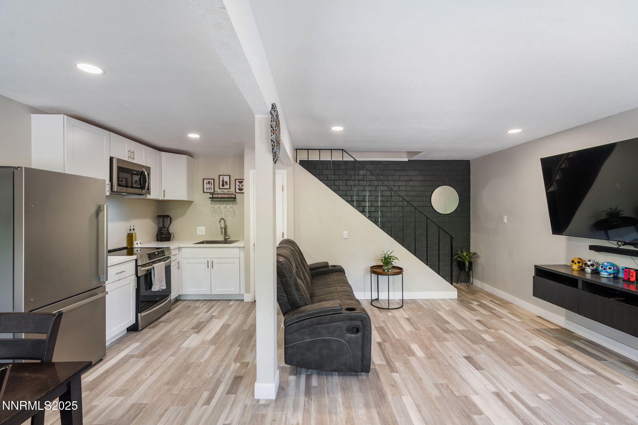940 Jamaica Avenue, Unit 3 Reno, NV 89502 - Photo 9 of 29 a living room with stainless steel appliances furniture and a flat screen tv