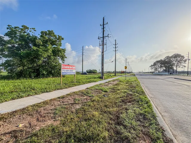 a large body of water with a building in the background