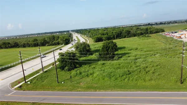 a view of a lush green field with lots of green space