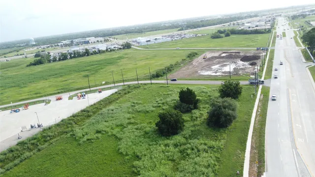 an aerial view of a golf course with the ocean view