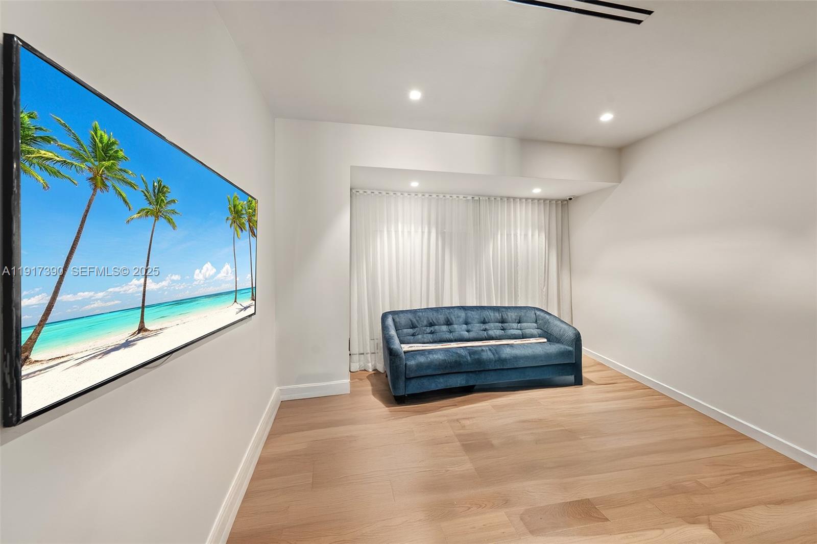 900 Washington Street Hollywood, FL 33019 - Photo 24 of 61 a living room with a couch and a large window