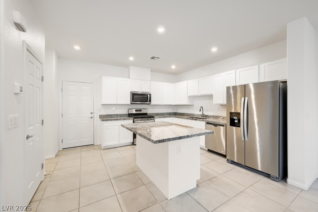489 Filaree Place Henderson, NV 89015 - Photo 5 of 36 Sleek kitchen with large island & ample seating