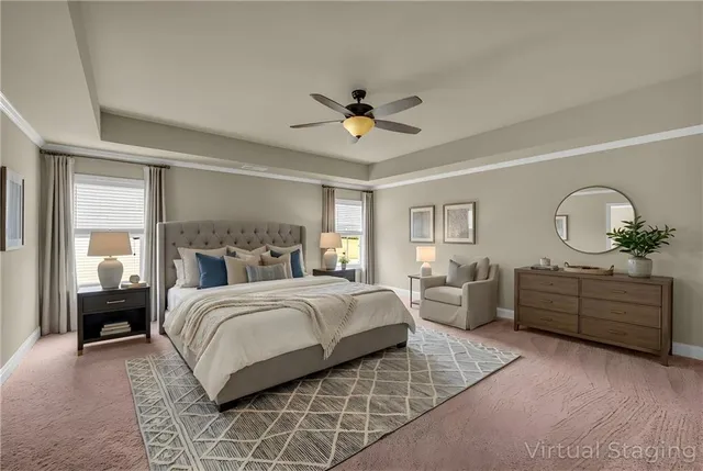 a view of a livingroom with a ceiling fan and window