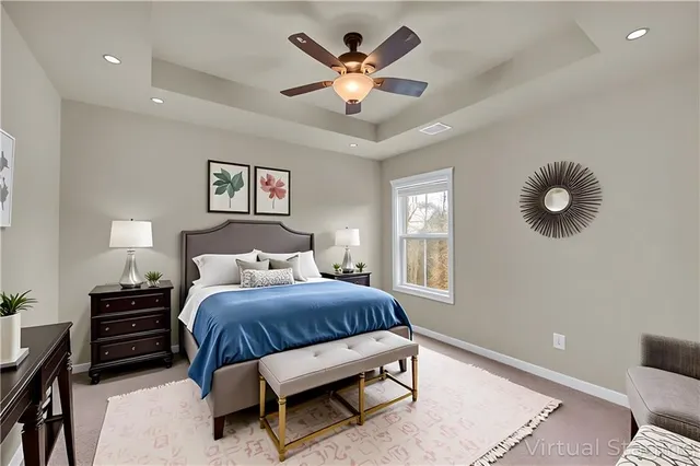 a view of an empty room and a ceiling fan