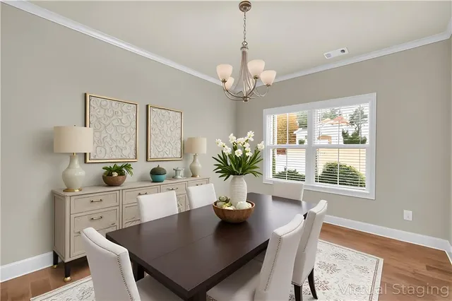 a view of a dining room with furniture window and wooden floor