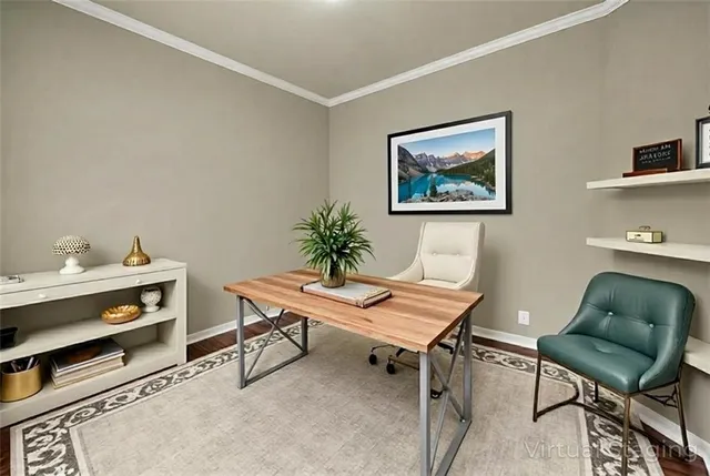 a view of a workspace with furniture and wooden floor