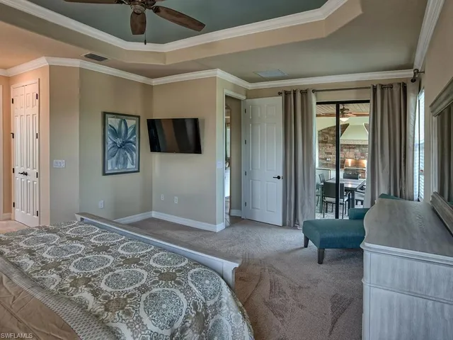 a bedroom with a large bed and a couch