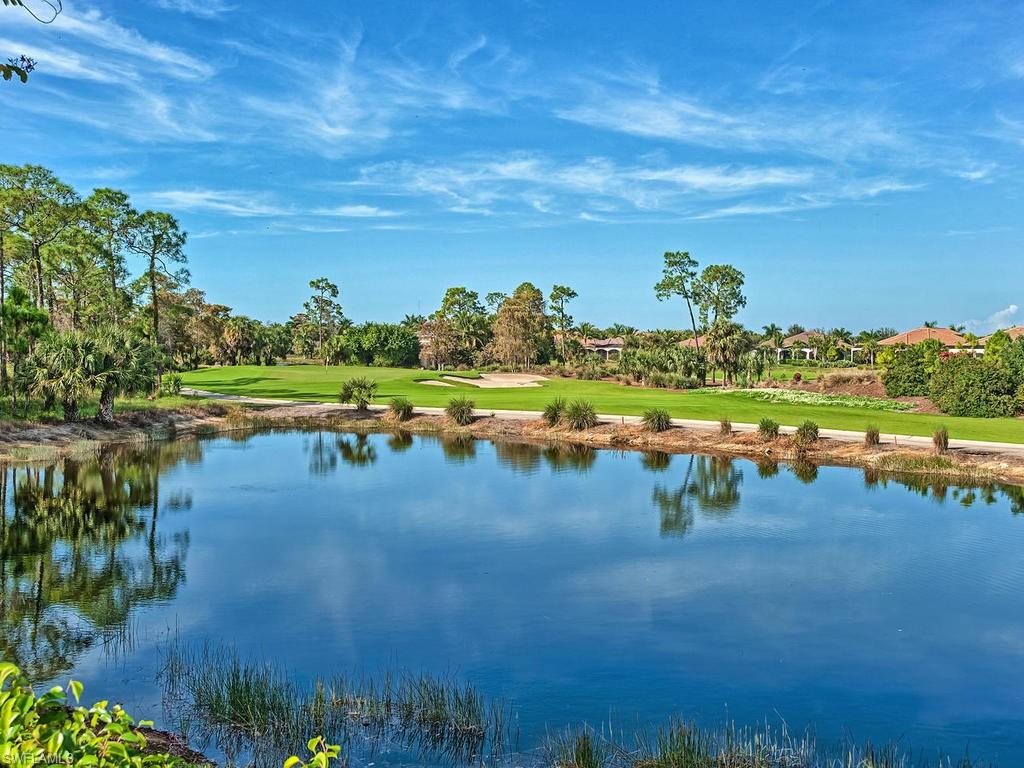 2850 Aviamar Circle Naples, FL 34114 - Photo 22 of 26 a view of a lake with a yard
