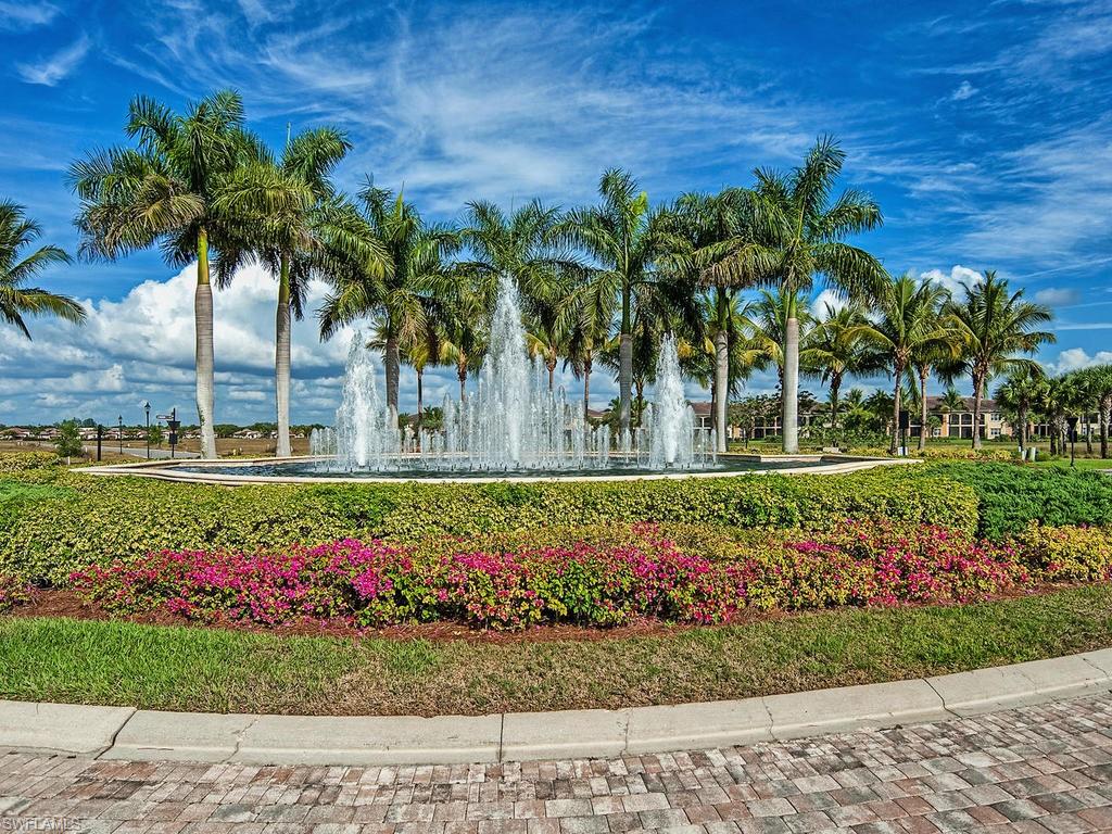 2850 Aviamar Circle Naples, FL 34114 - Photo 25 of 26 a front view of a multi story building