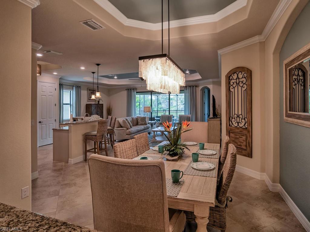 2850 Aviamar Circle Naples, FL 34114 - Photo 5 of 26 a view of a dining room with furniture and a chandelier