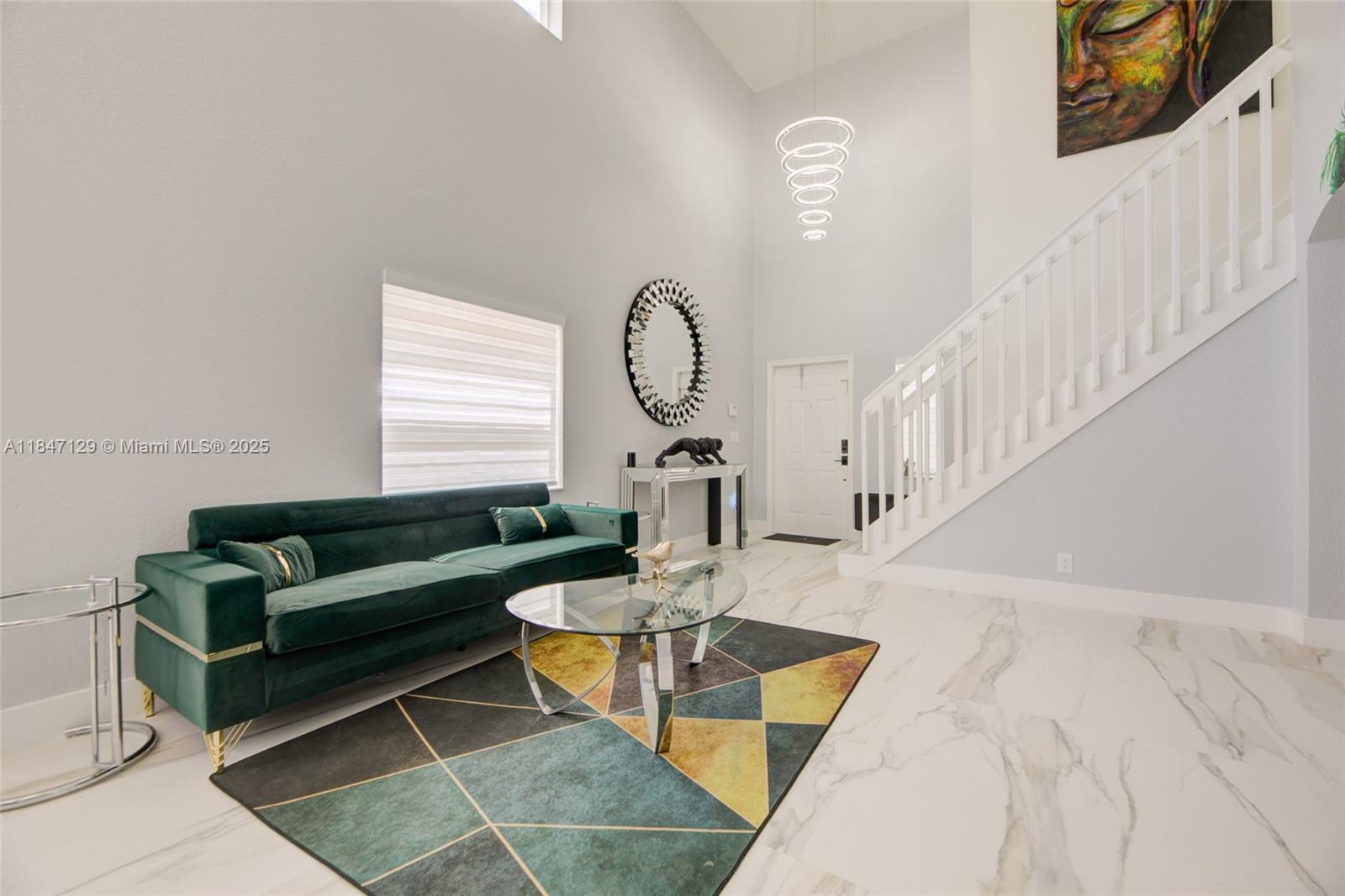 6073 Spring Isles Boulevard Lake Worth, FL 33463 - Photo 11 of 51 a living room with furniture and a large window