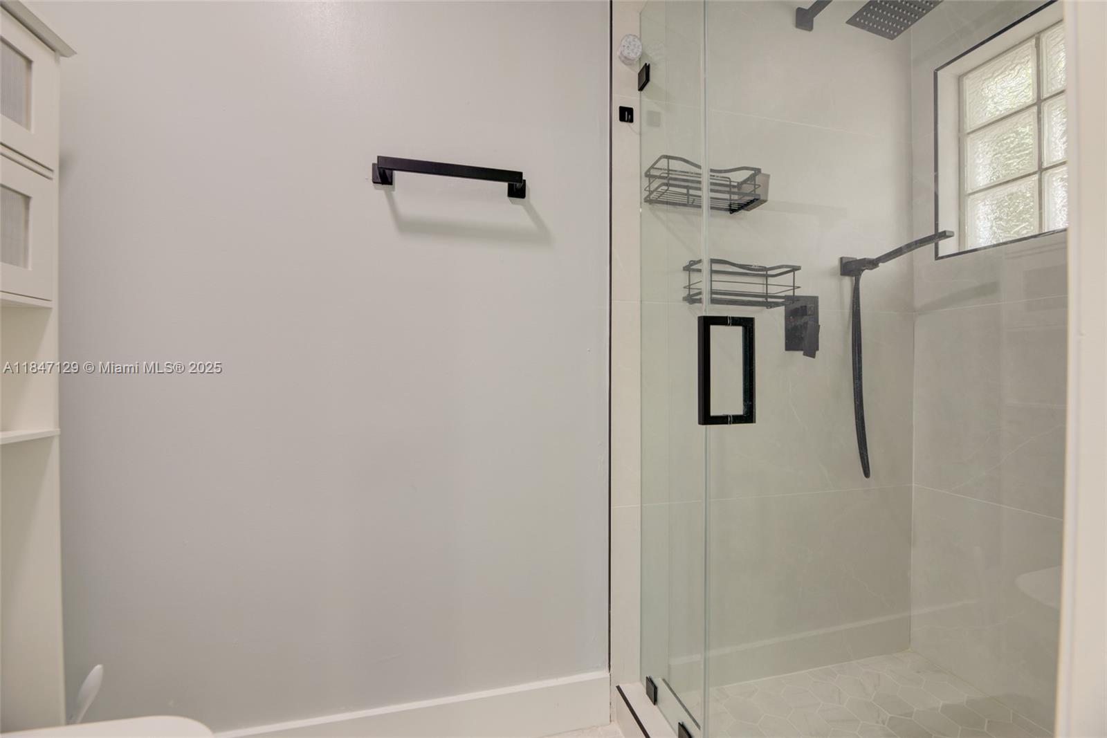 6073 Spring Isles Boulevard Lake Worth, FL 33463 - Photo 32 of 51 a bathroom with a shower