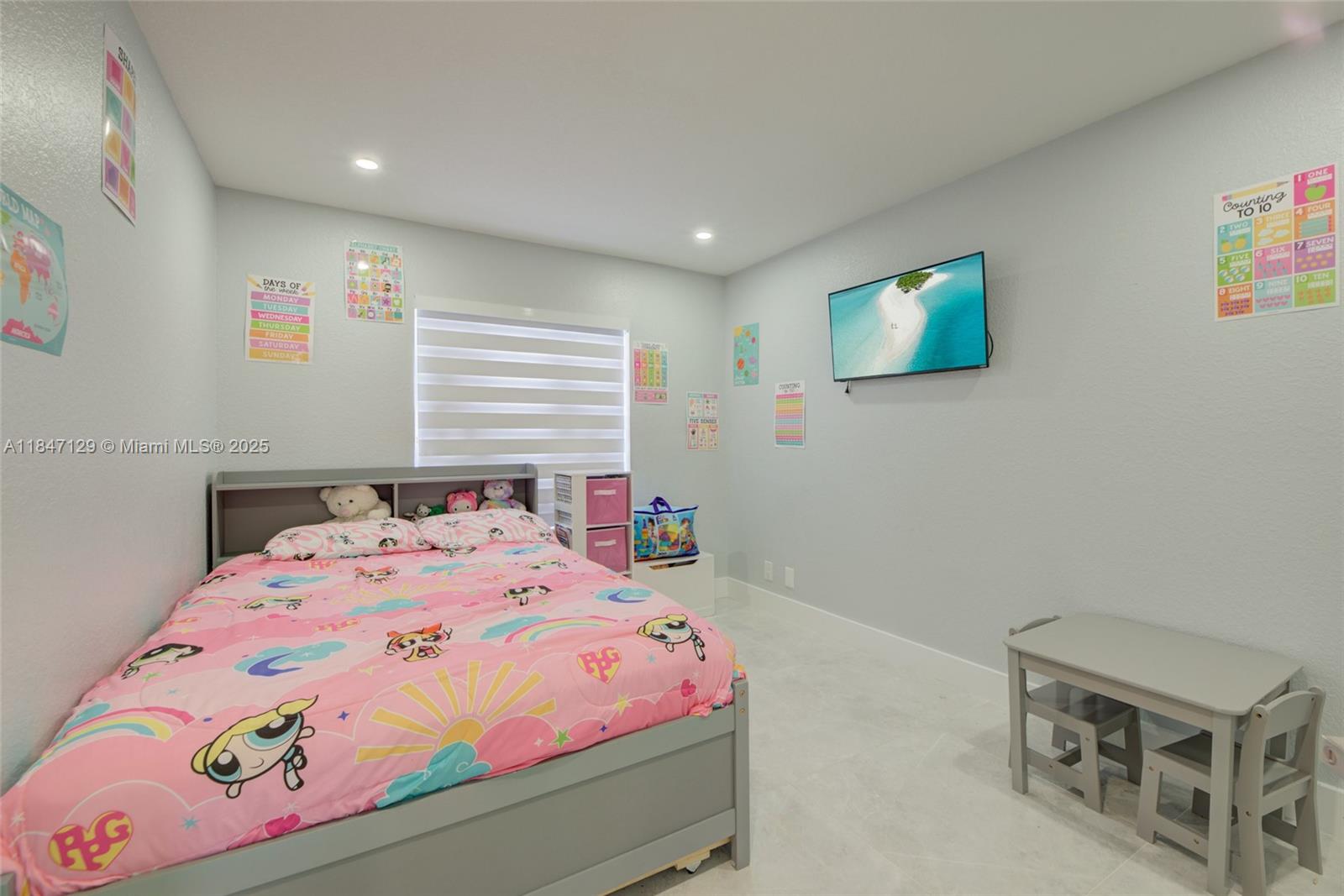 6073 Spring Isles Boulevard Lake Worth, FL 33463 - Photo 34 of 51 a bedroom with a bed and a window