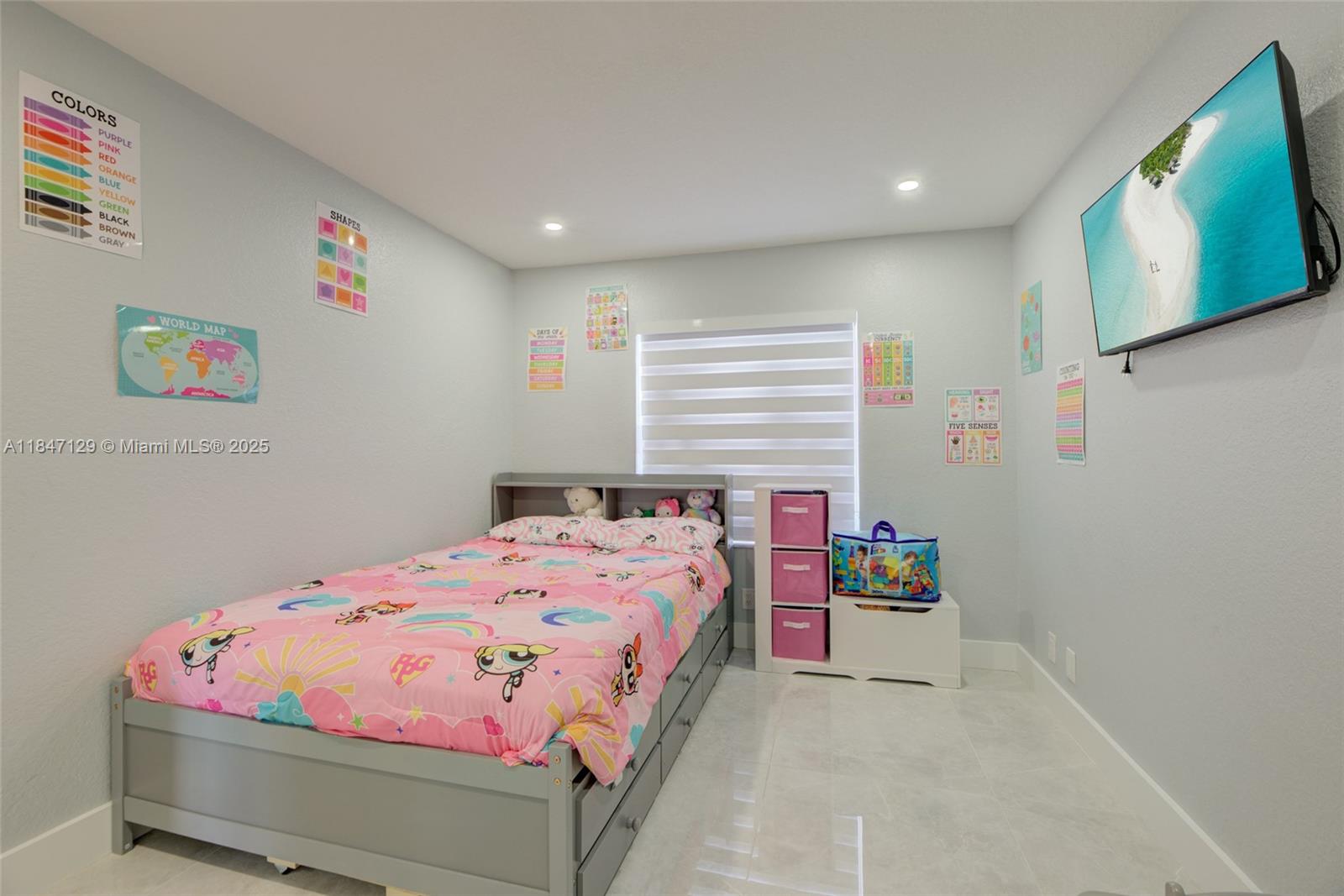 6073 Spring Isles Boulevard Lake Worth, FL 33463 - Photo 35 of 51 a bedroom with a bed and a tv