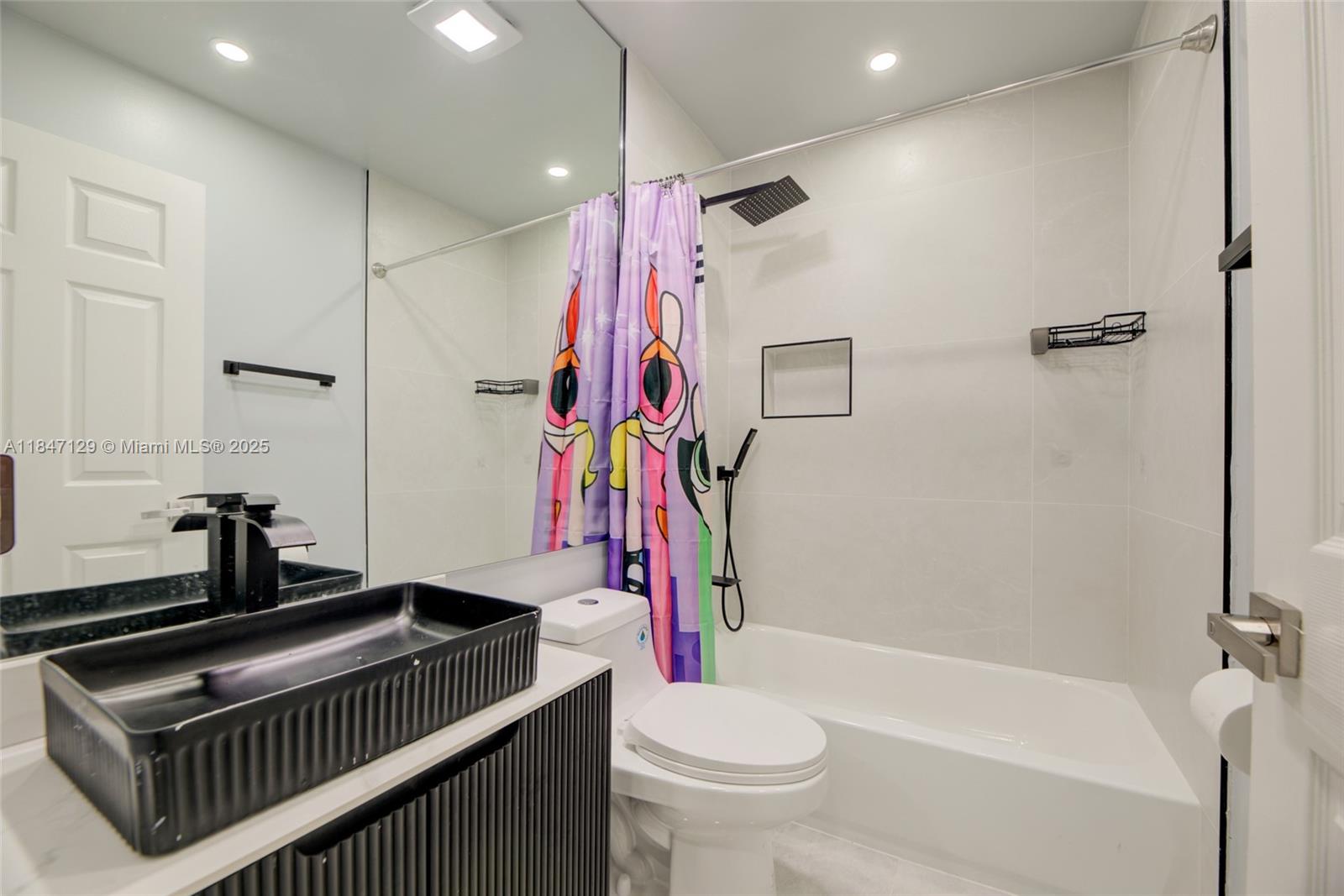 6073 Spring Isles Boulevard Lake Worth, FL 33463 - Photo 39 of 51 a bathroom with a granite countertop sink a toilet and shower