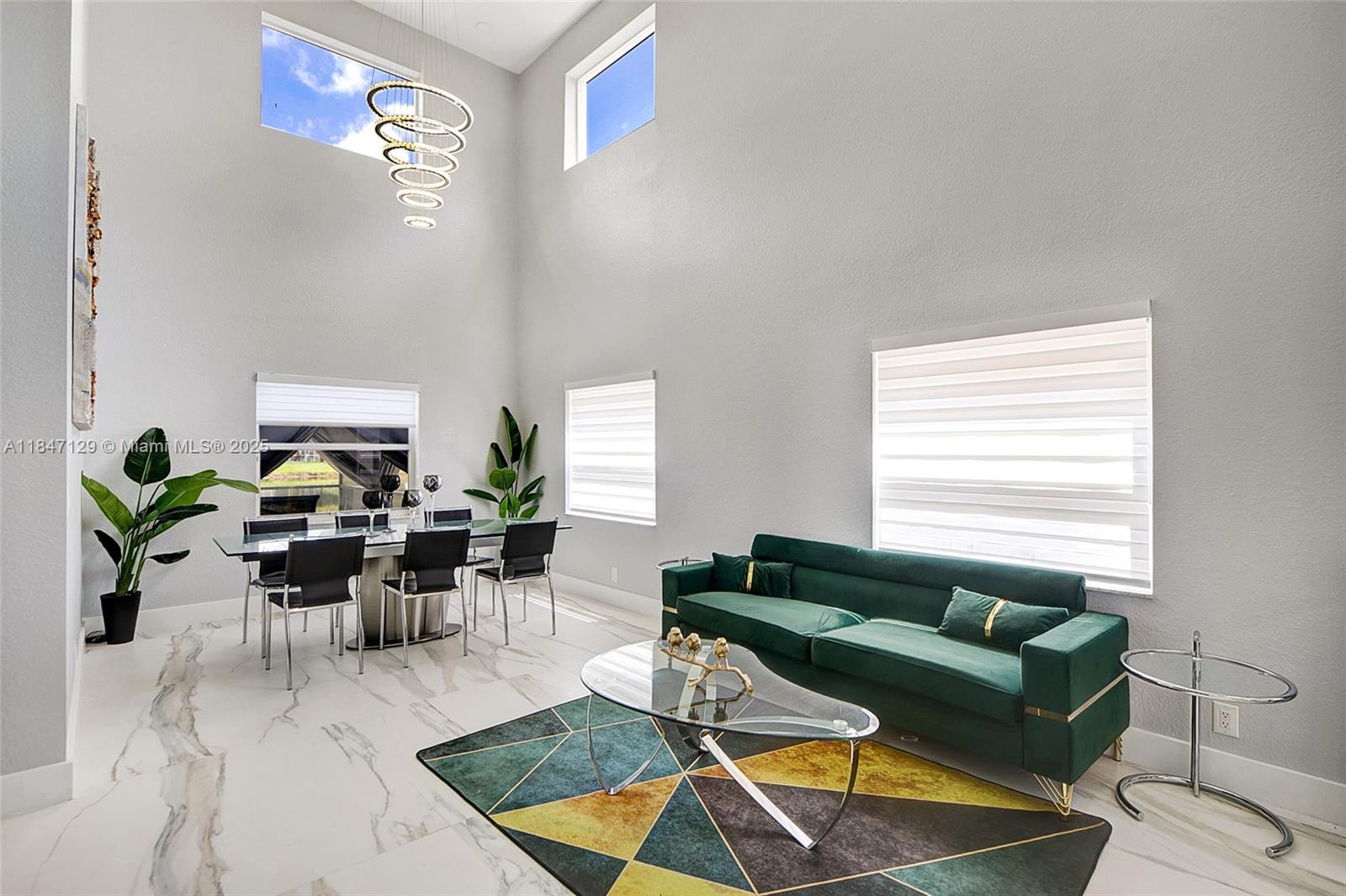 6073 Spring Isles Boulevard Lake Worth, FL 33463 - Photo 7 of 51 a living room with furniture and a window