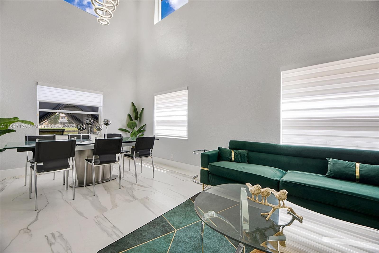 6073 Spring Isles Boulevard Lake Worth, FL 33463 - Photo 8 of 51 a living room with furniture and a window
