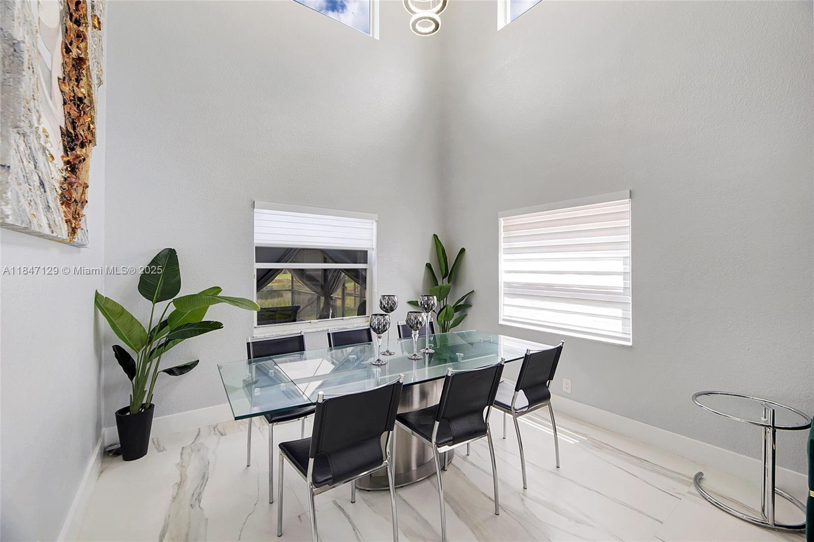 6073 Spring Isles Boulevard Lake Worth, FL 33463 - Photo 9 of 51 a dining room with furniture and window