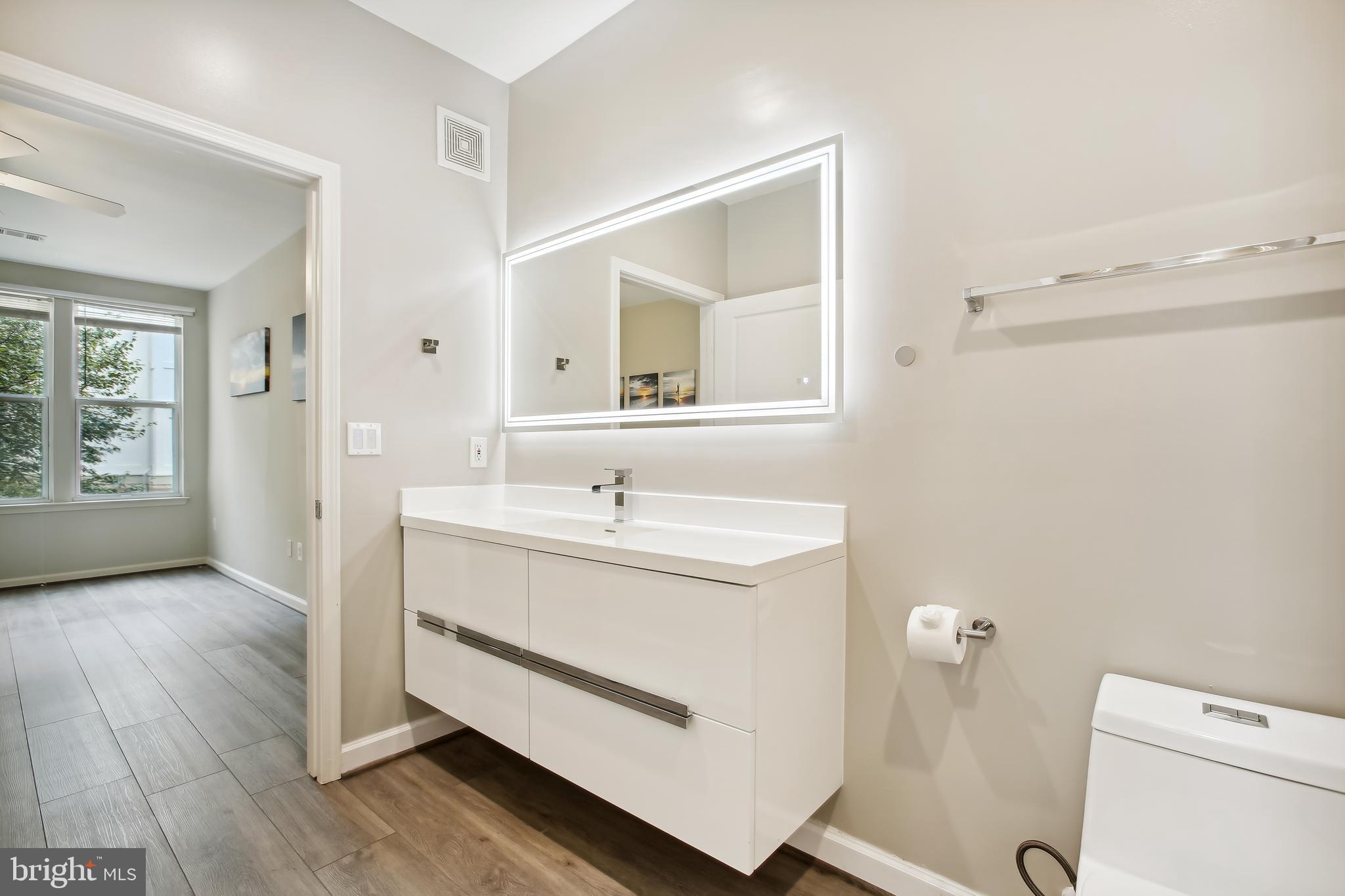12000 Market Street, Unit 281 Reston, VA 20190 - Photo 27 of 50 Mirror has anti-fog and touchpad dimmer controls
