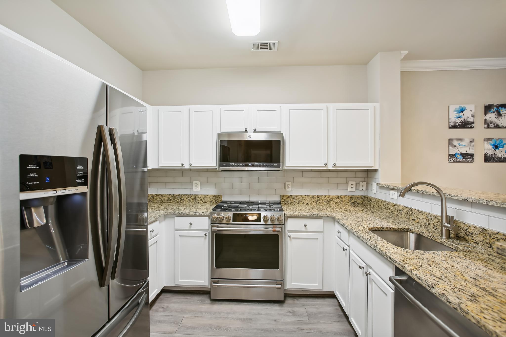 12000 Market Street, Unit 281 Reston, VA 20190 - Photo 3 of 50 Upgraded kitchen with stainless appliances