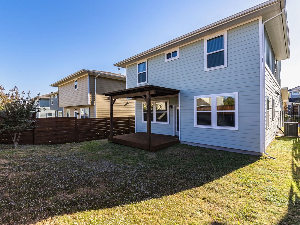 2208 Capulet Street Austin, TX 78741 - Photo 22 of 23 a front view of a house with garden