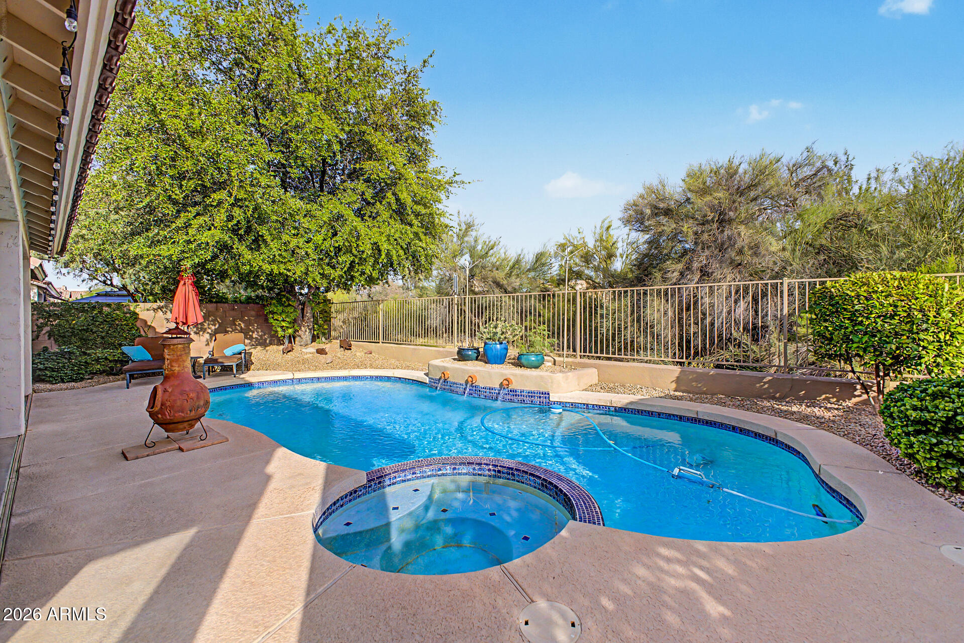 4309 East Rancho Caliente Drive Cave Creek, AZ 85331 - Photo 28 of 37 a view of a swimming pool with a patio