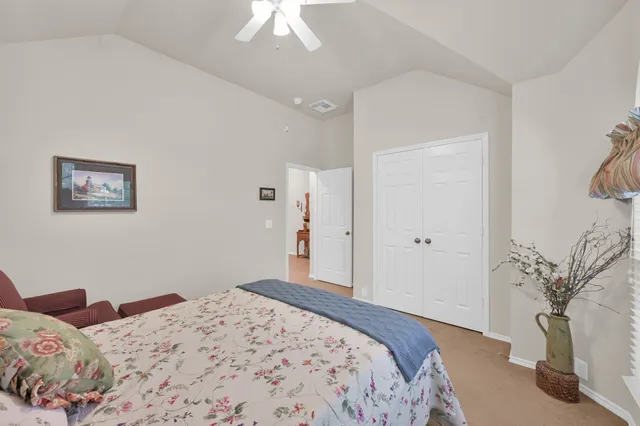 a bathroom with a sink vanity granite toilet and shower