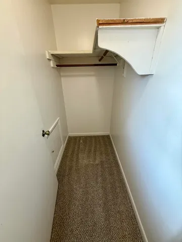 view of a room with rack on the wall