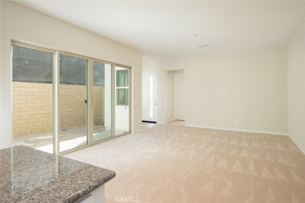 158 Spectacle Irvine, CA 92618 - Photo 10 of 19 an empty room with sliding glass door