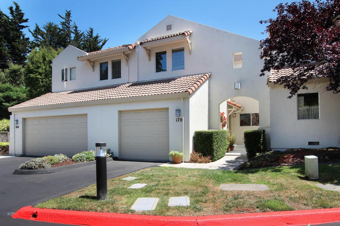 a front view of a house with garden
