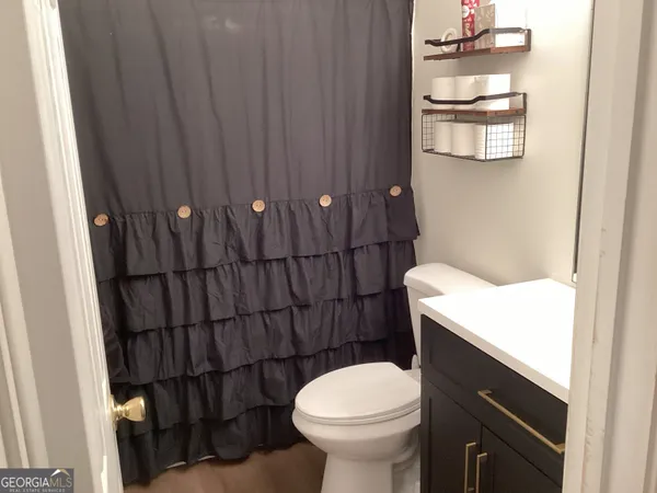 a bathroom with a toilet and a sink