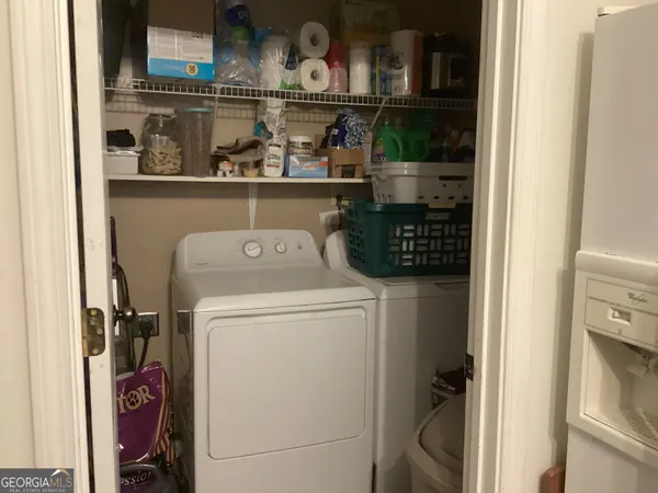 a utility room with dryer and washer