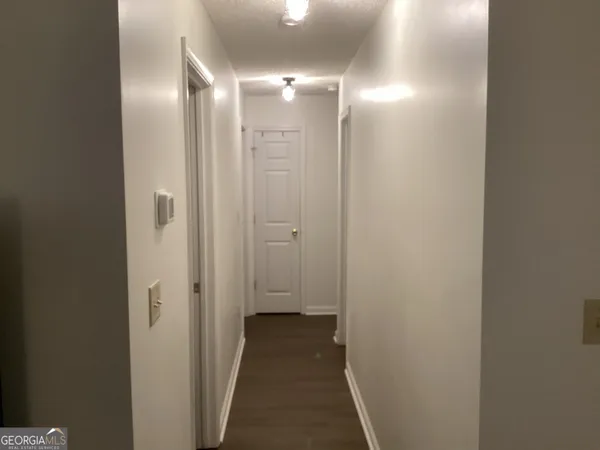 a view of a bathroom from a hallway