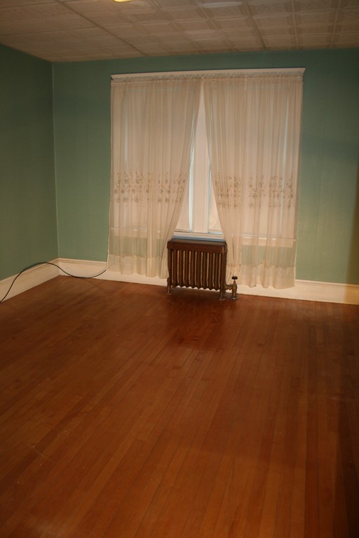 1 Coventry Road Worcester, MA 01606 - Photo 17 of 22 a view of wooden floor and windows in a room