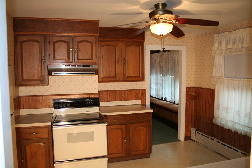 1 Coventry Road Worcester, MA 01606 - Photo 8 of 22 a kitchen with stainless steel appliances granite countertop a stove and a microwave