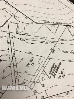 a close up of a white wall with a white comforter