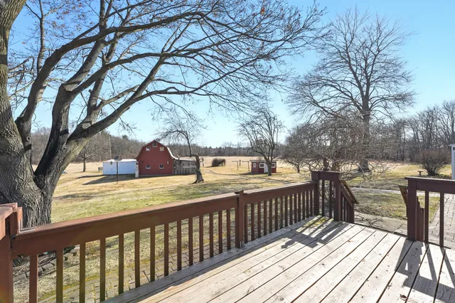 a house that has a tree in front of it